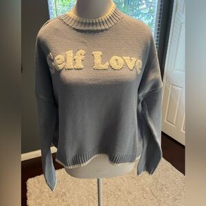 New Self Love powder blue cardigan. Rounded collar with white trim. Size…